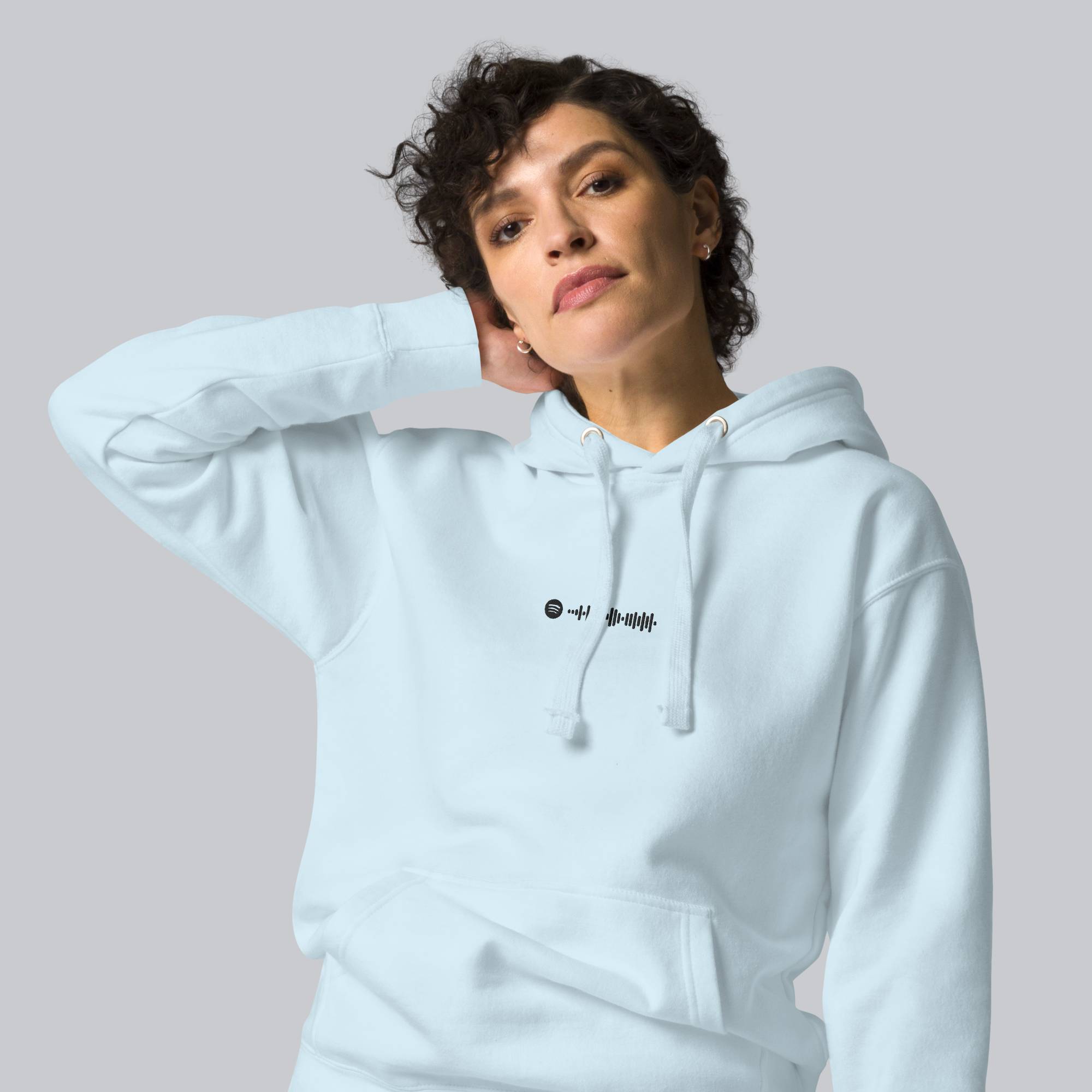 Light blue hoodie with a custom Music Code