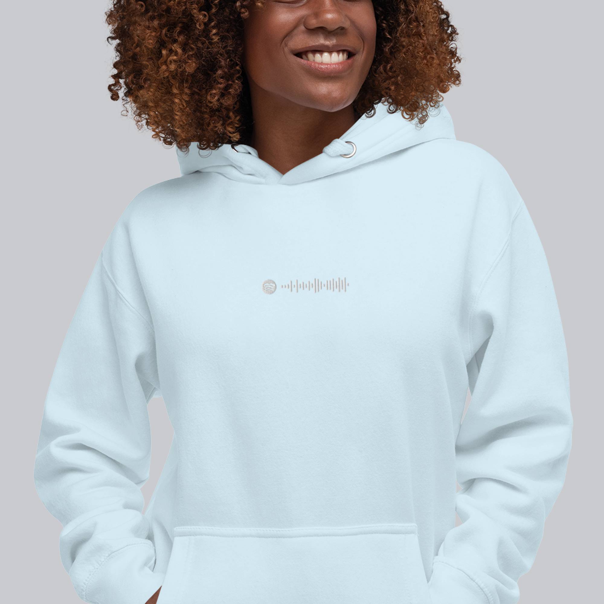 Light blue hoodie with a custom Music Code