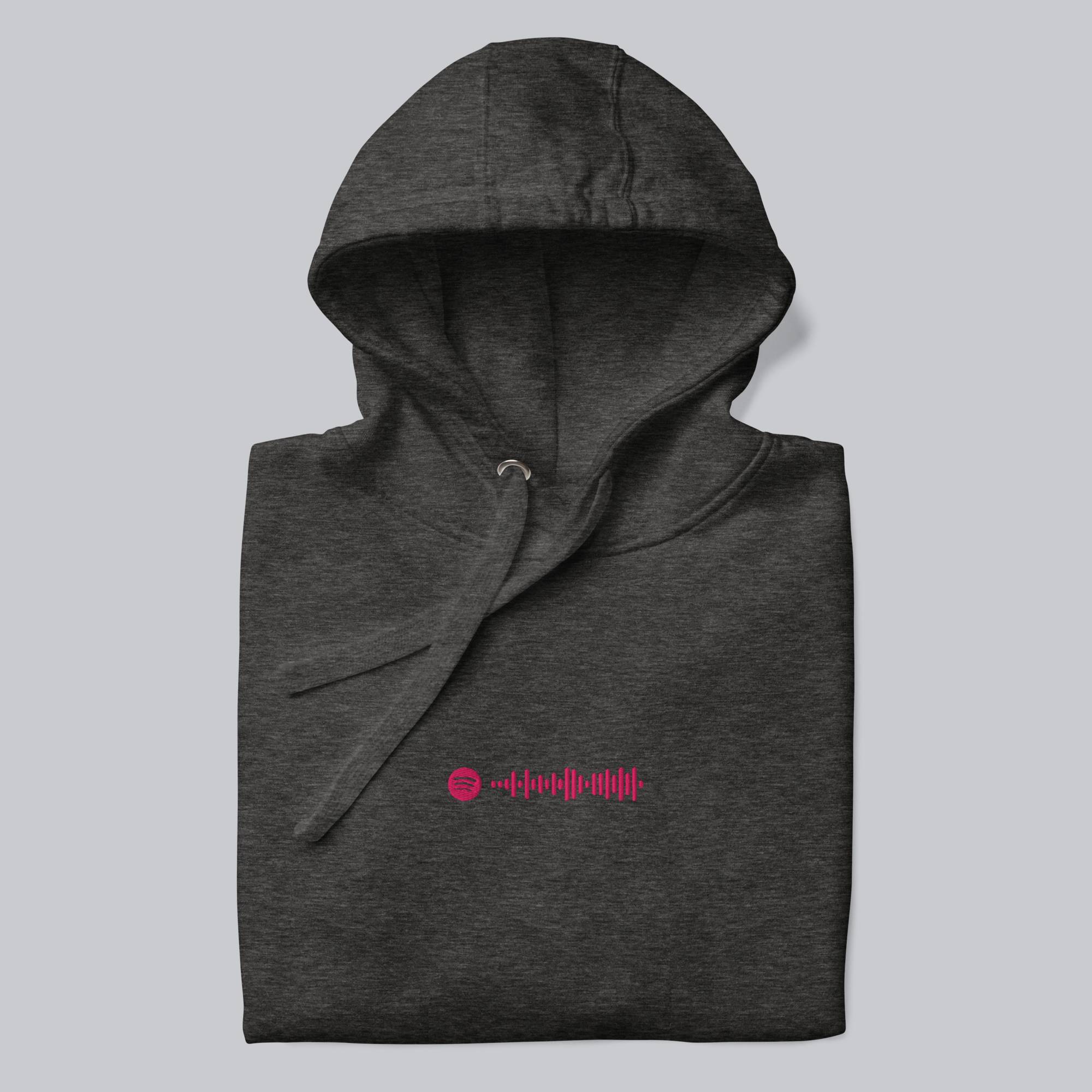 Dark grey hoodie with a custom Music Code