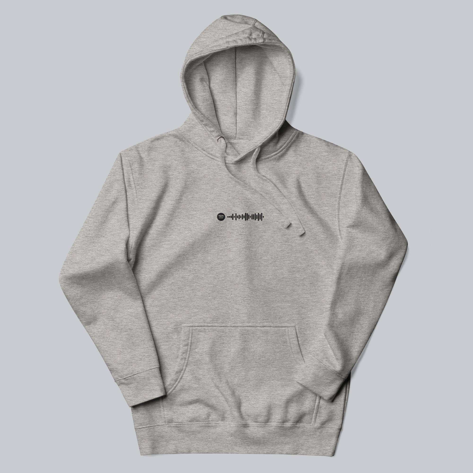 Grey hoodie with a custom Music Code