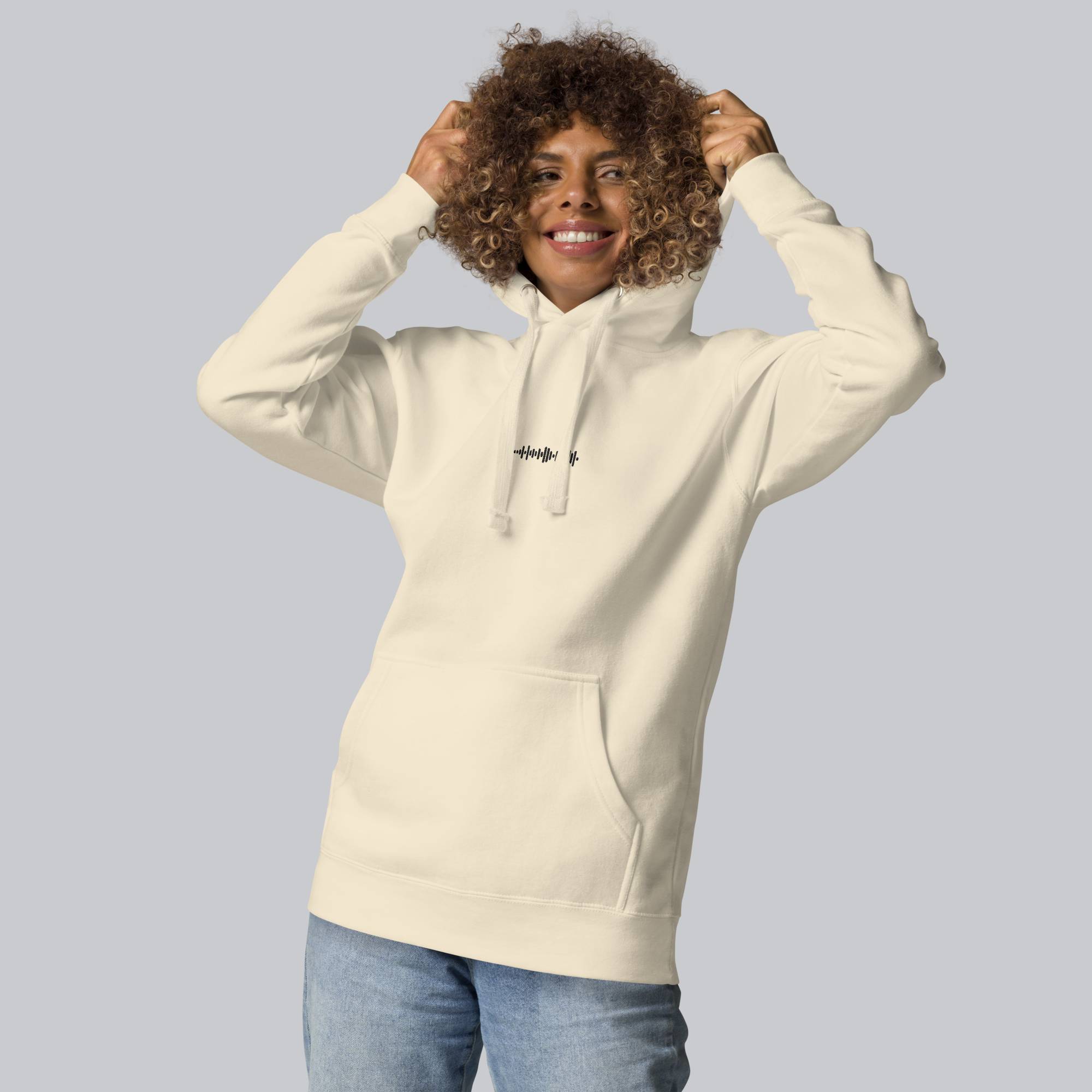 Light yellow hoodie with a custom Music Code