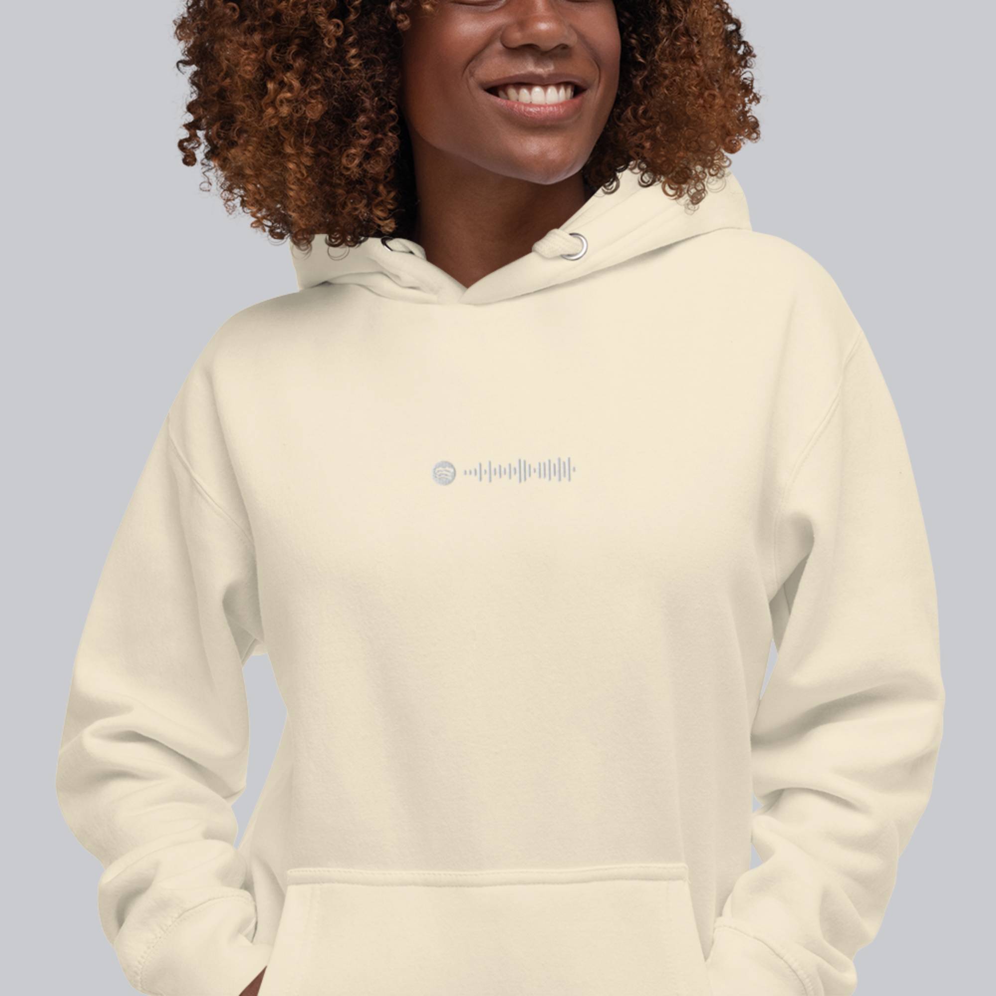 Light yellow hoodie with a custom Music Code