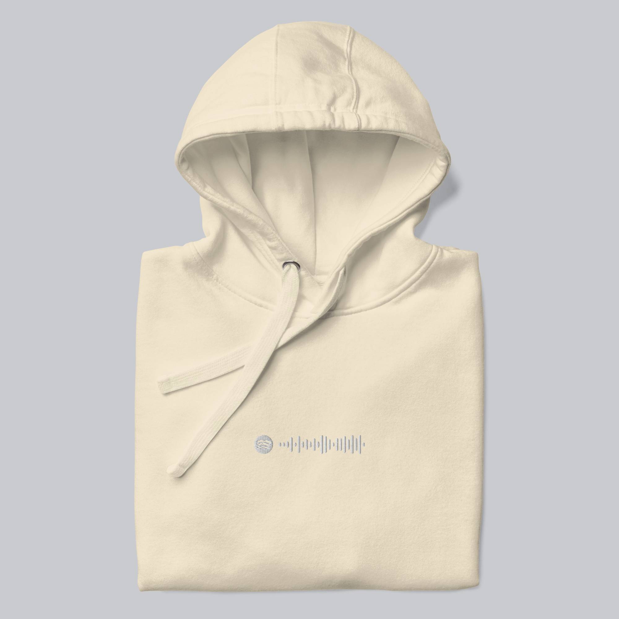 Light yellow hoodie with a custom Music Code