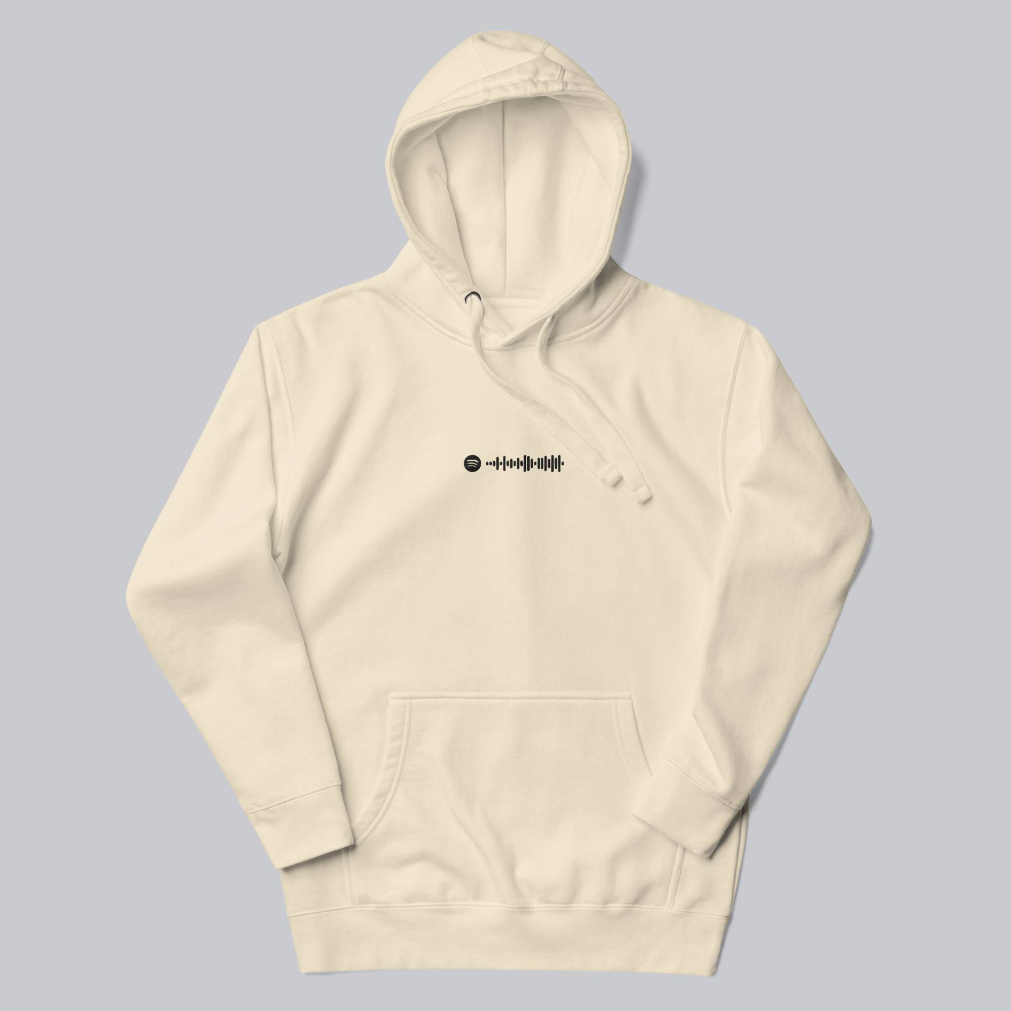 Light yellow hoodie with a custom Music Code