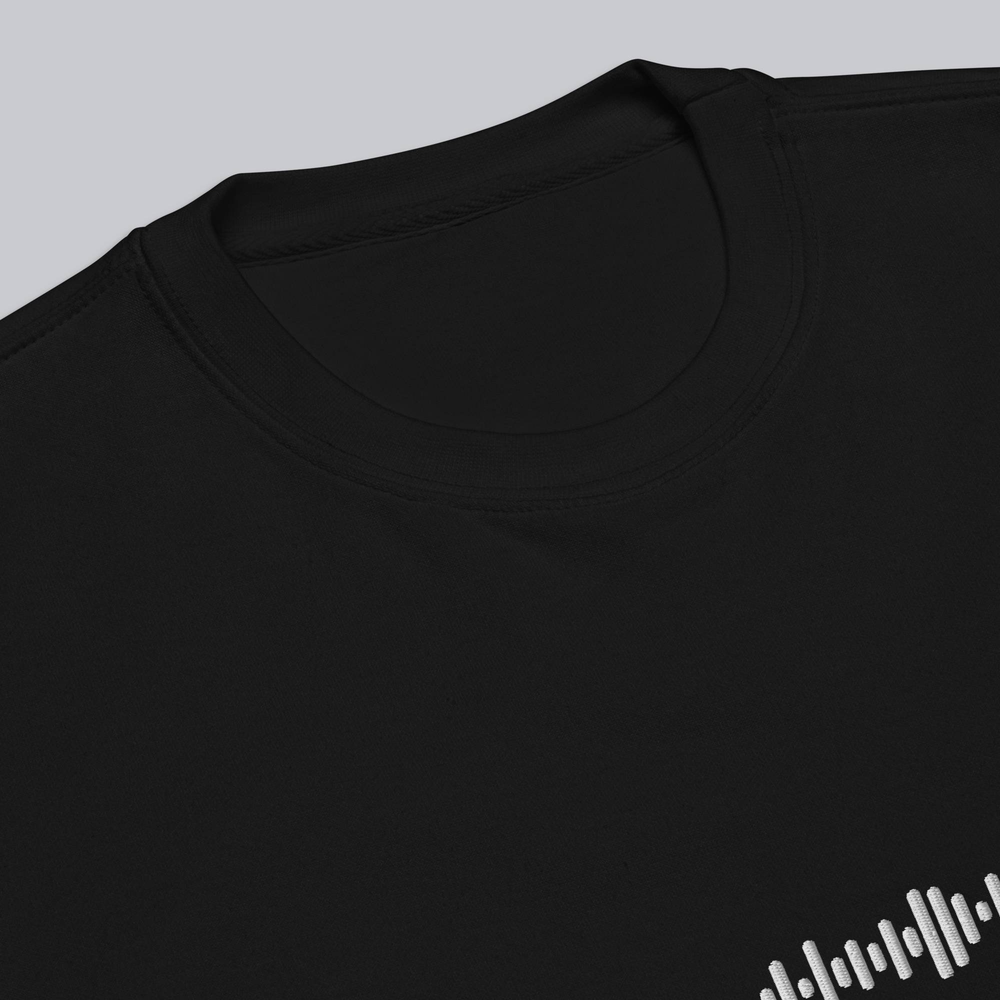 Black long-sleeve shirt with custom Music Code