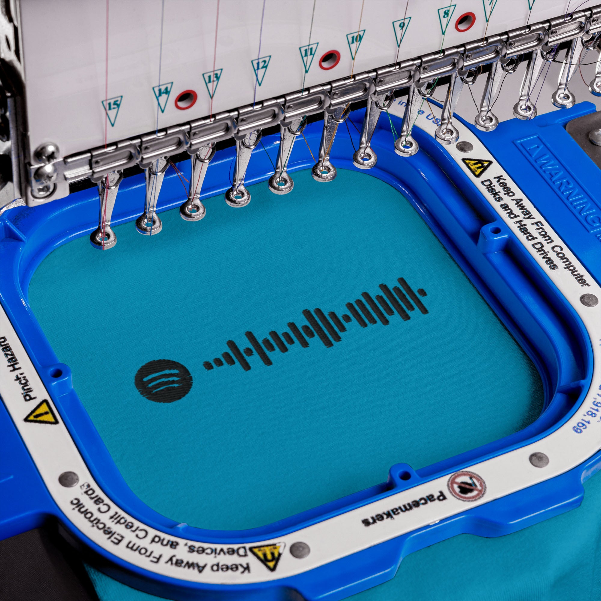 Aqua Tshirt with embroidered custom music code