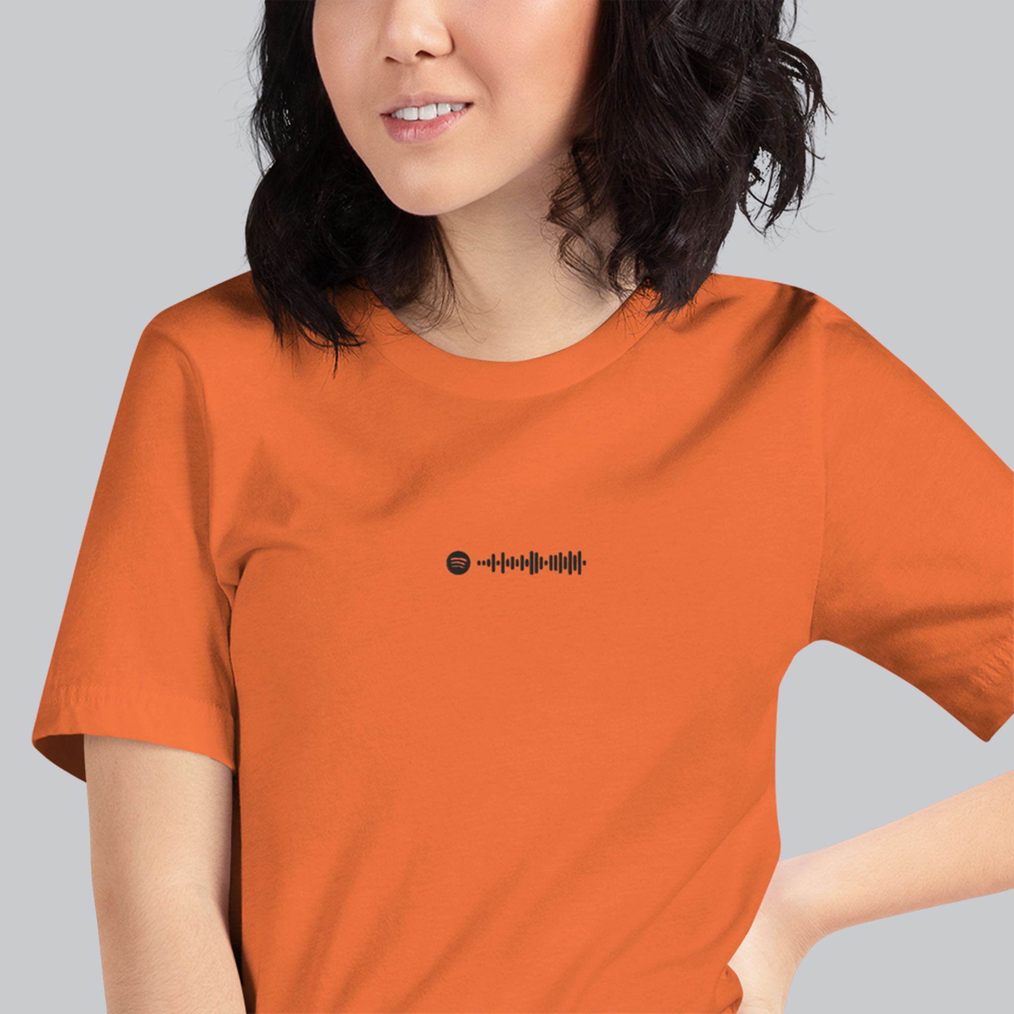 Orange Tshirt with embroidered custom music code