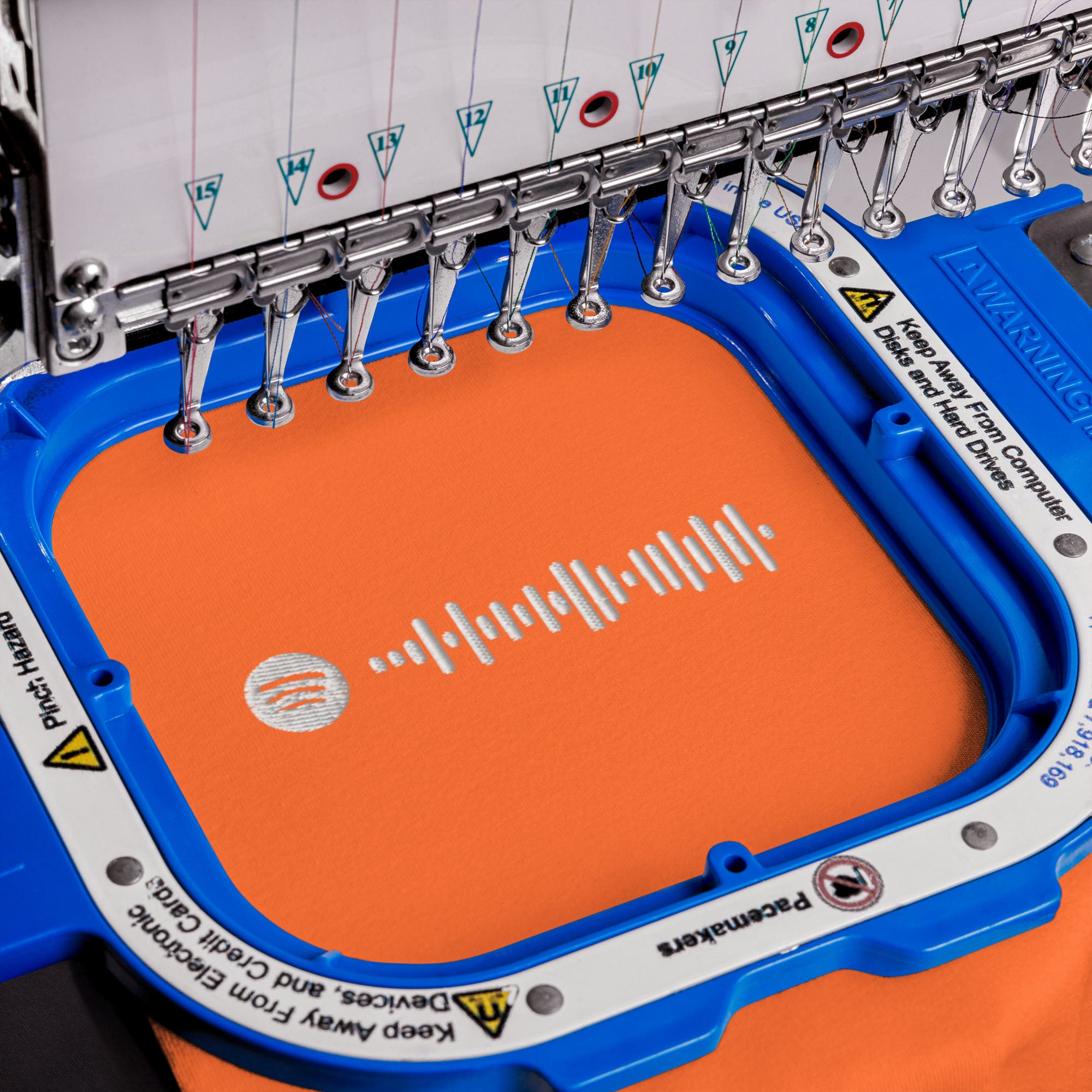 Orange Tshirt with embroidered custom music code