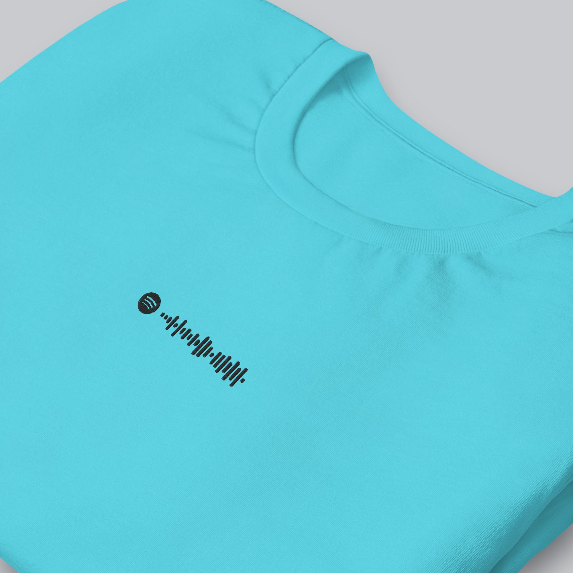 Turquoise Tshirt with embroidered custom music code