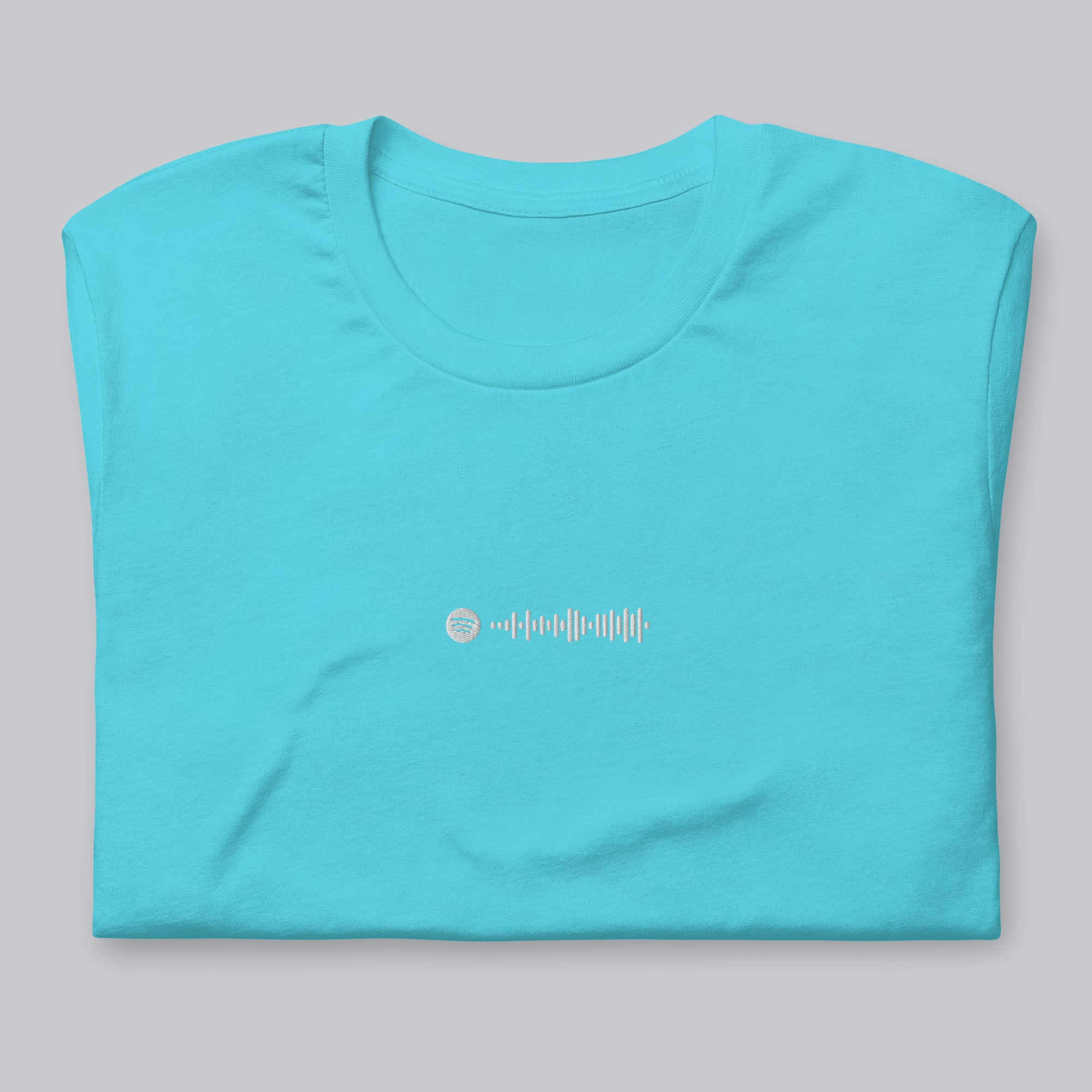 Turquoise Tshirt with embroidered custom music code