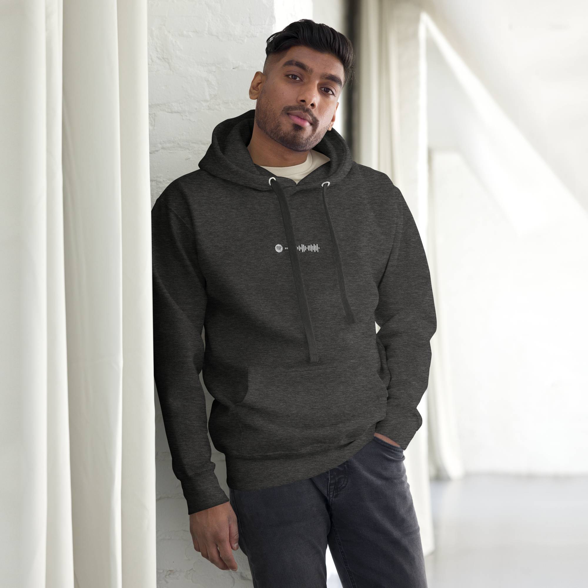 Dark grey hoodie with a custom Music Code