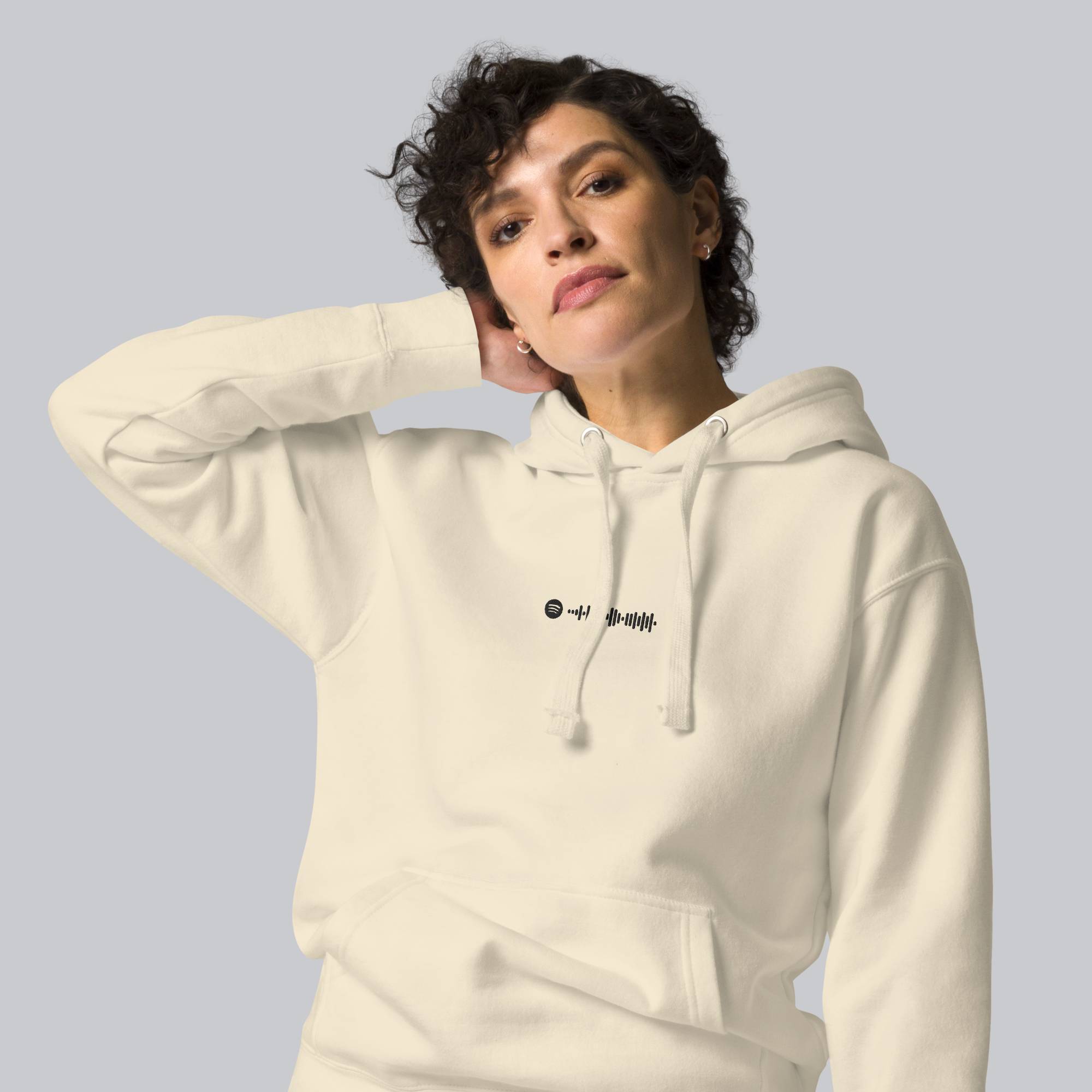 Light yellow hoodie with a custom Music Code