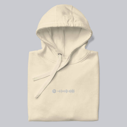 Light yellow hoodie with a custom Music Code