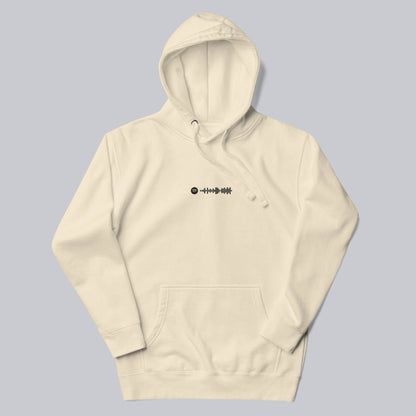 Light yellow hoodie with a custom Music Code