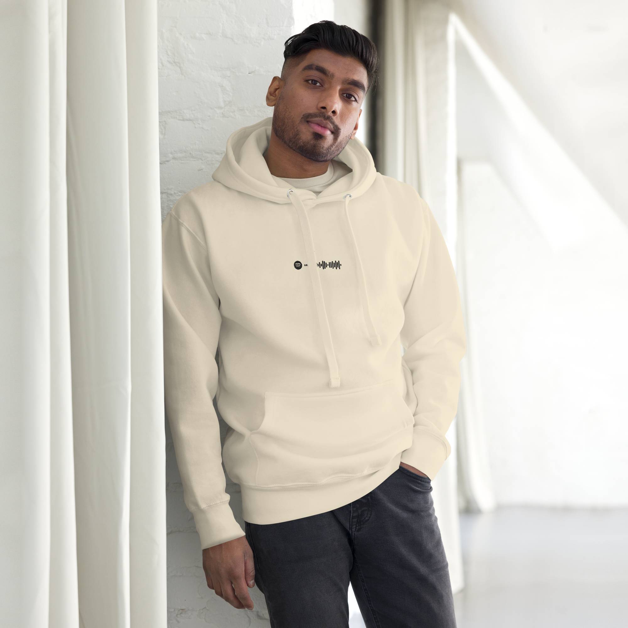 Light yellow hoodie with a custom Music Code